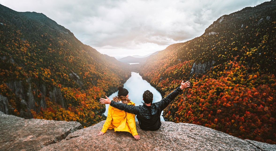 A couple overlooks the immaculate views of Canada's fall colors.