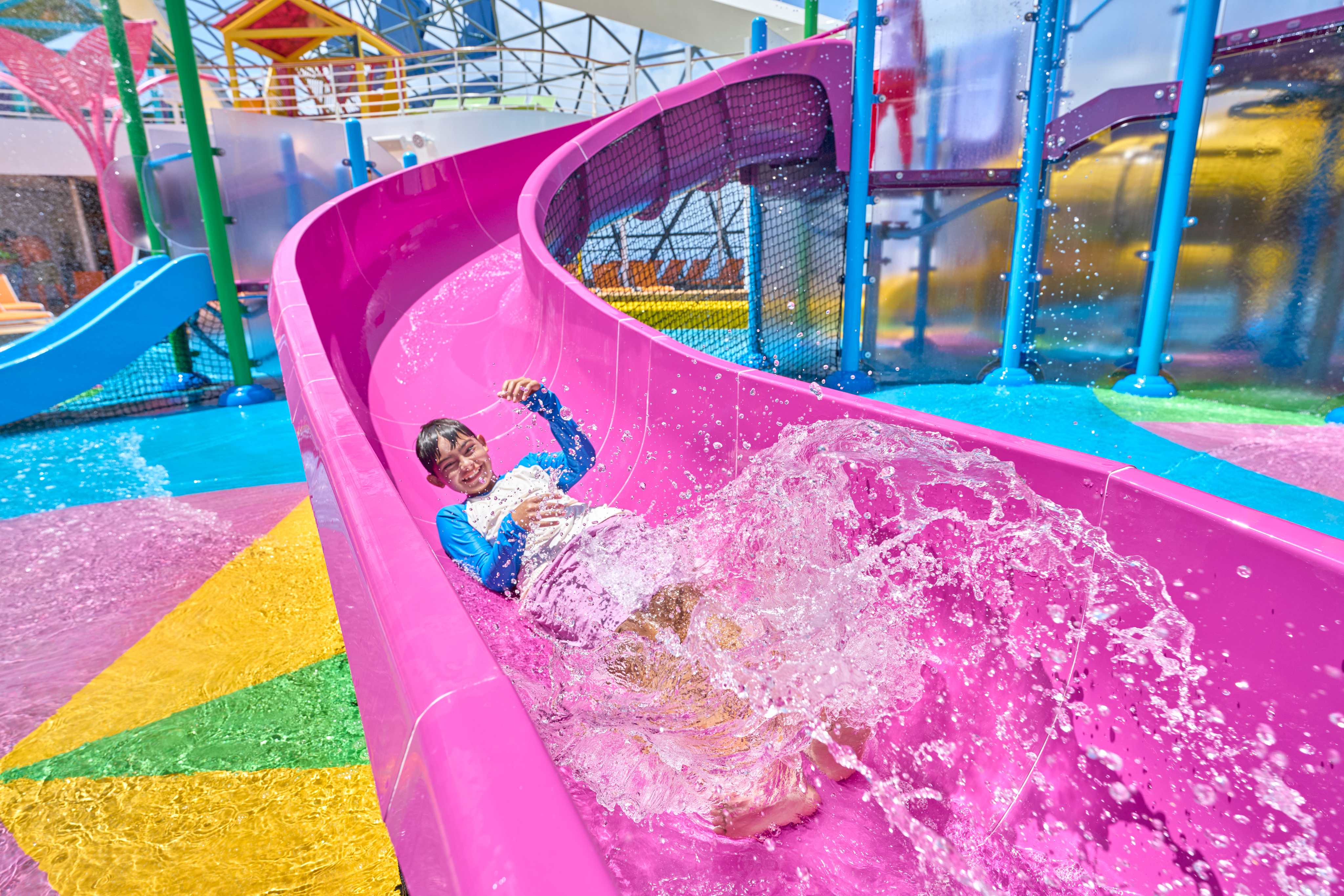 Royal Caribbean Utopia of the Seas ship sailing the Bahamas family playing on water slide