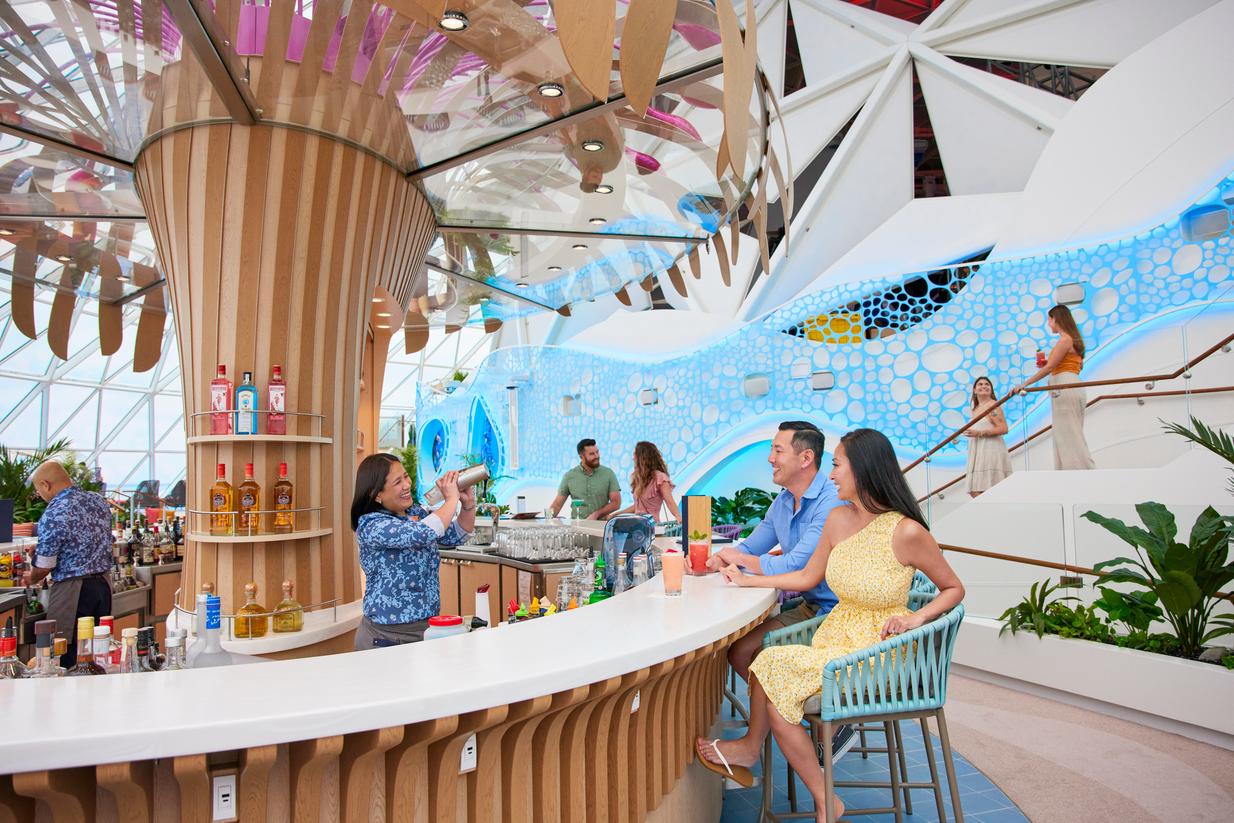 Royal Caribbean couple enjoying drinks at cruise ship bar